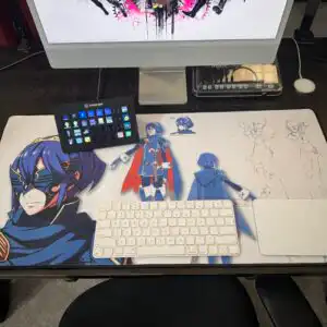 Lucina desk mat – Fire Emblem concept art mouse pad shown in real desk setup with iMac, Stream Deck, keyboard, and trackpad