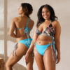 Two models wearing the Mark of the Exalt Fire Emblem swimsuit featuring Chrom from Awakening, showcasing the front and back of the blue string bikini set.