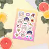 Fire Emblem sticker sheet inspired by Summer Scramble from Fire Emblem Awakening, styled on a pale yellow surface with sliced citrus fruits.