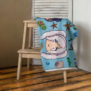 Summer Scramble (Ocean) - Beach Towel Fire Emblem Towel placed on a wooden chair, showing the whimsical Summer Scramble (Ocean) print with soft aquatic blue colors and character art.