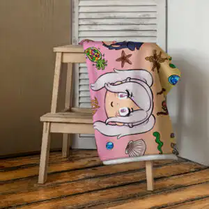 Summer Scramble (Sunset) - Beach Towel Fire Emblem Towel styled on a wooden chair, highlighting the playful Summer Scramble artwork and warm sunset tones.