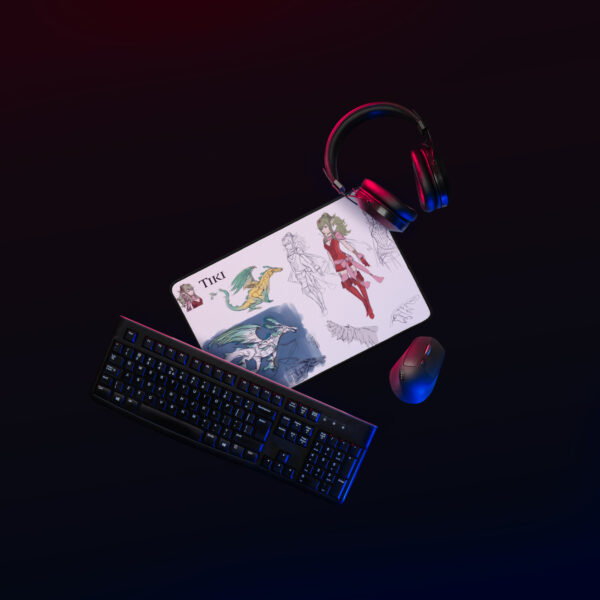 Another angled view of the Small Tiki Desk Mat - Concept Art in a full desk layout with keyboard and mouse.