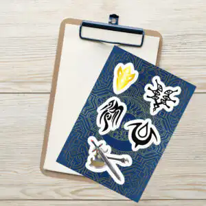 Fire Emblem Sticker sheet on clipboard featuring iconic game symbols and legendary weapons.