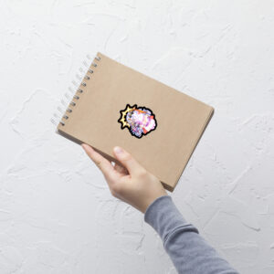 Small Fire Emblem Sticker of Vali and Baldur on a spiral notebook, shown held in hand.