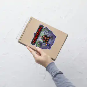 Notebook being tilted to show the vibrant, large Lavender Hell Fire Emblem Sticker design.