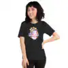 Black tee, female model with hand on hip – Female model in black Vali’s Baldr Plushie – Fire Emblem Shirt, hand on hip and smiling.
