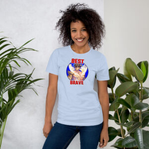 Fire Emblem Shirt – Best Brave Eikþyrnir design featured on a light blue unisex tee, modeled by a woman standing near plants.