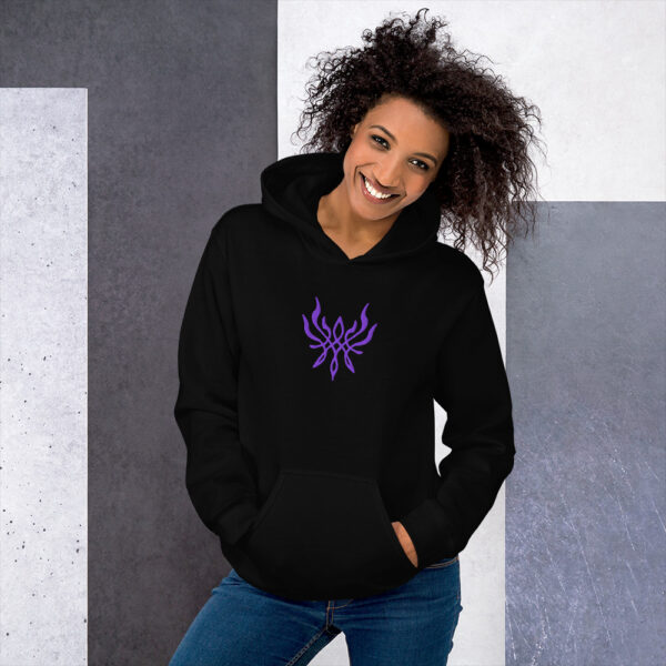 Fire Emblem Hoodie with the Crest of Flames embroidery on a black unisex hoodie, modeled by a smiling woman.