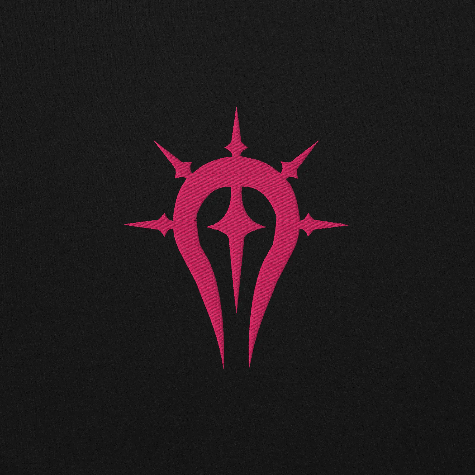 Duma Faithful - Unisex Embroidered Hoodie Fire Emblem Hoodie close-up of the pink embroidered Duma Faithful crest on black fabric.