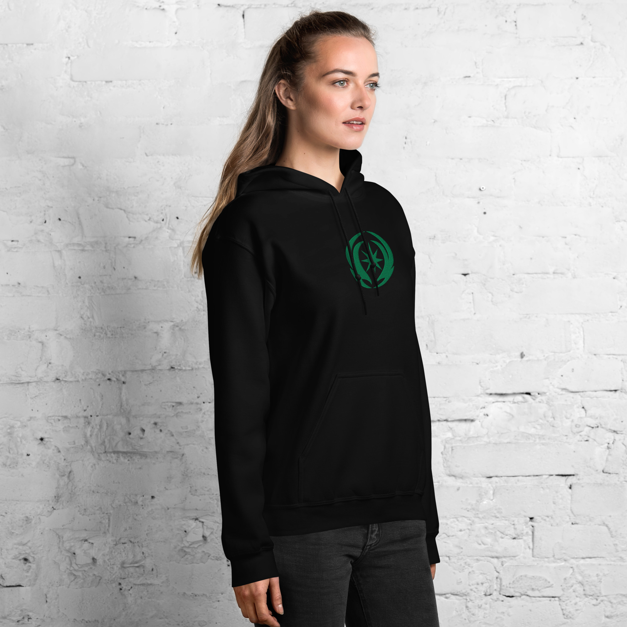 Revelation - Unisex Embroidered Hoodie Fire Emblem Hoodie featuring Revelation emblem, model wearing black unisex hoodie.