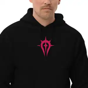 Fire Emblem Hoodie with pink Duma Faithful symbol on a black hoodie, modeled by a man from the chest up.