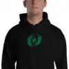 Fire Emblem Hoodie with Revelation crest embroidery worn by man in black unisex hoodie.