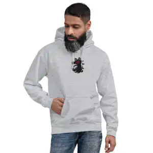 A man wearing the gray Fire Emblem Hoodie with the Shadows wolf crest embroidered on front.