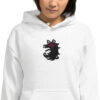 Shadows - Unisex Hoodie A woman wearing the white Fire Emblem Hoodie featuring the Shadows wolf emblem in black and red embroidery.