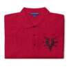 Folded red Fire Emblem polo with black Grimleal symbol embroidered on the chest