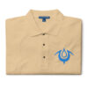 Folded tan Fire Emblem polo with blue Brand of the Exalt embroidered on the chest