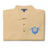 Folded tan Fire Emblem polo with blue Brand of the Exalt embroidered on the chest