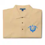 Folded tan Fire Emblem polo with blue Brand of the Exalt embroidered on the chest